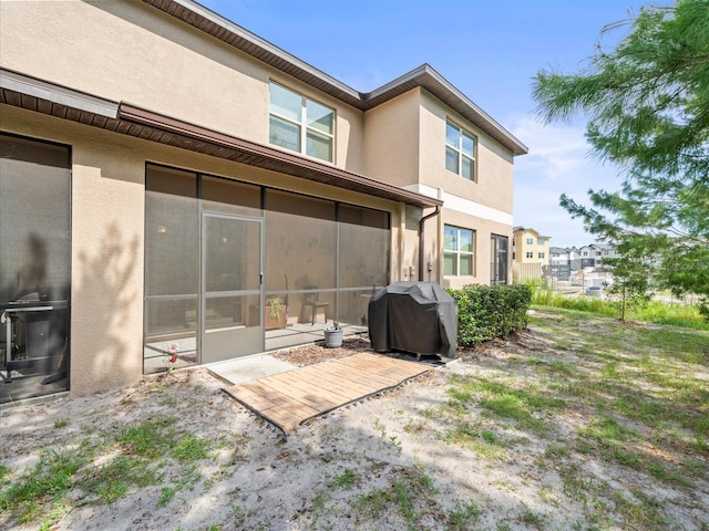 rear view of house with a sunroom