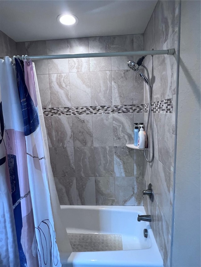 bathroom with shower / tub combo