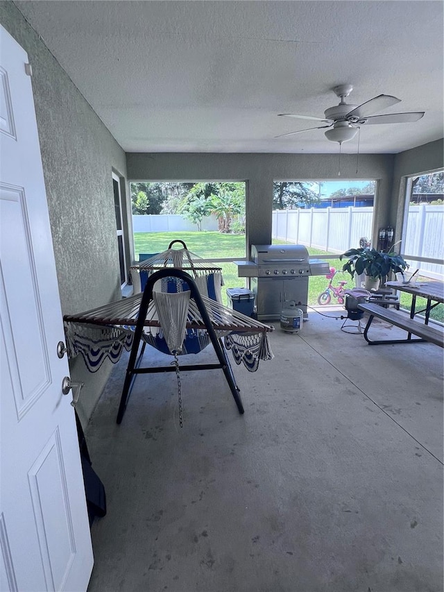 view of patio / terrace with ceiling fan and grilling area