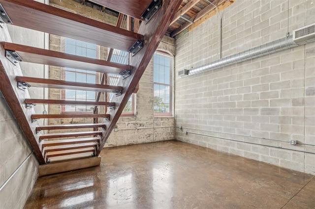 interior space featuring finished concrete flooring