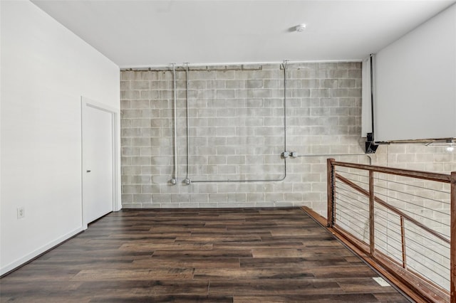 spare room with dark wood-type flooring