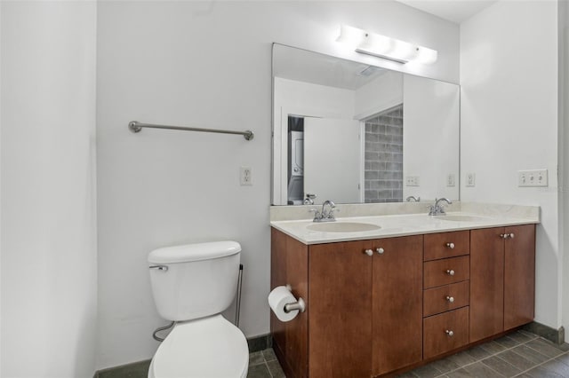 bathroom with tile patterned floors, toilet, and vanity