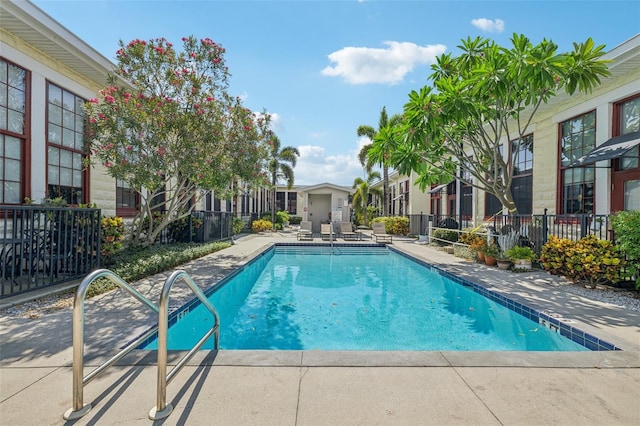 view of swimming pool featuring a patio area