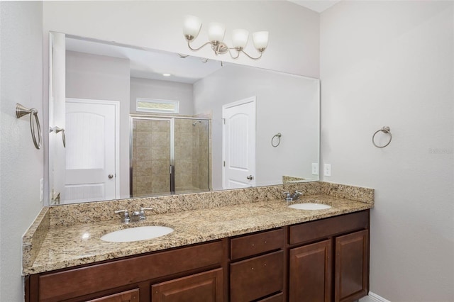 bathroom featuring a stall shower, a sink, and double vanity