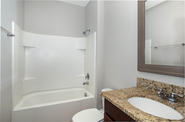 bathroom with shower / washtub combination, vanity, and toilet