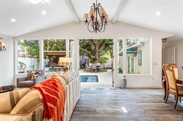 interior space with plenty of natural light, hardwood / wood-style flooring, a chandelier, and lofted ceiling with beams