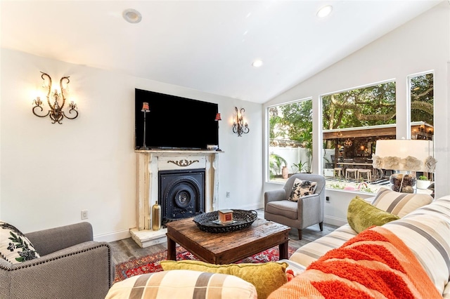 living room featuring hardwood / wood-style floors and vaulted ceiling