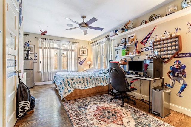 bedroom featuring hardwood / wood-style flooring and ceiling fan