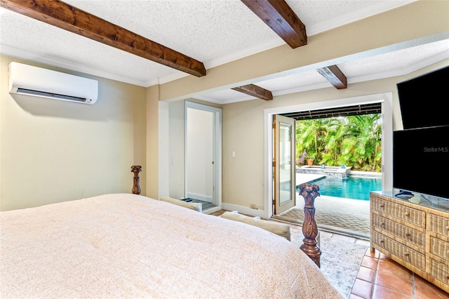 bedroom with beam ceiling, a textured ceiling, a wall unit AC, and access to exterior