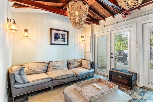 living room featuring vaulted ceiling with beams, an inviting chandelier, french doors, wooden ceiling, and tile patterned flooring