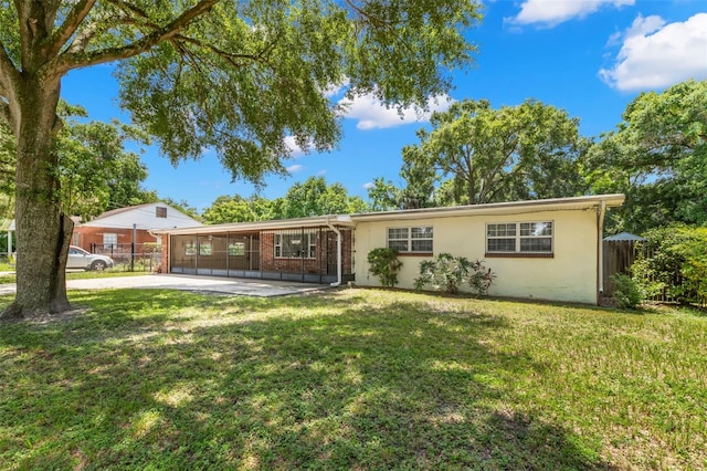 ranch-style home with a front yard