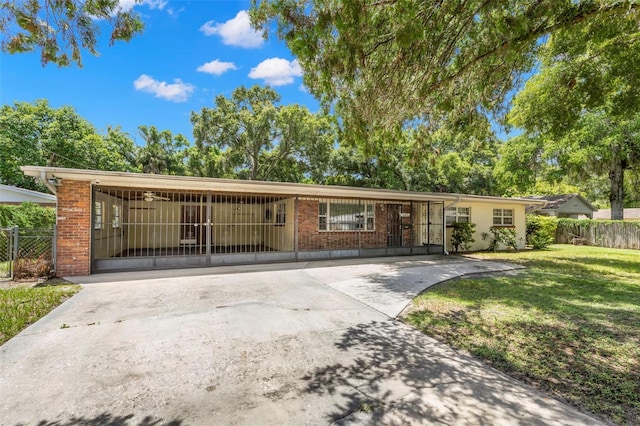 ranch-style home with a front lawn