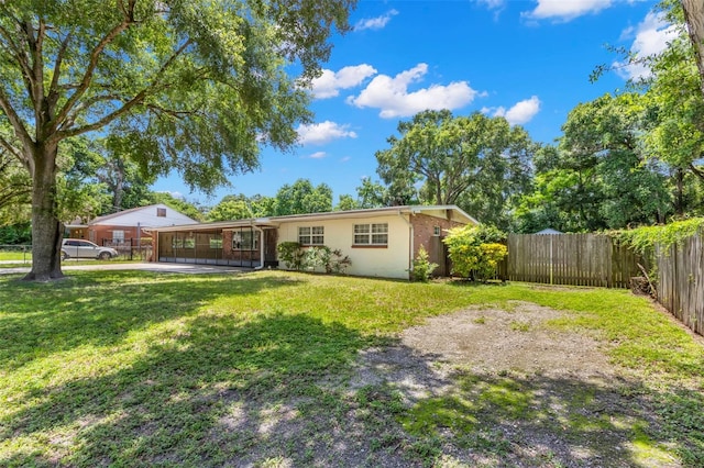 back of property with a lawn