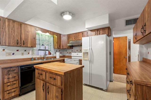 kitchen featuring backsplash, ventilation hood, butcher block countertops, white appliances, and light carpet