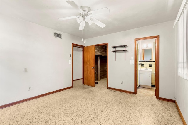 unfurnished bedroom featuring ceiling fan, sink, connected bathroom, and a closet