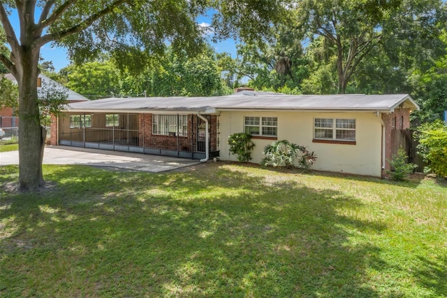 ranch-style home with a front yard