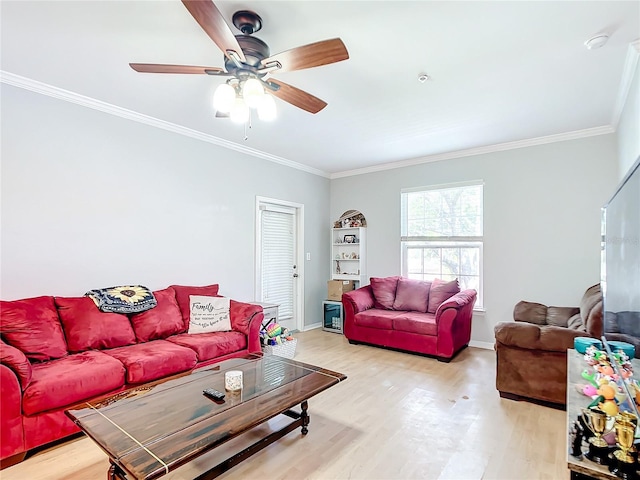 living room with light hardwood / wood-style flooring, ceiling fan, and ornamental molding