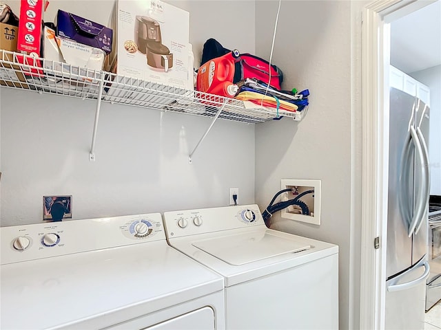 laundry room featuring separate washer and dryer