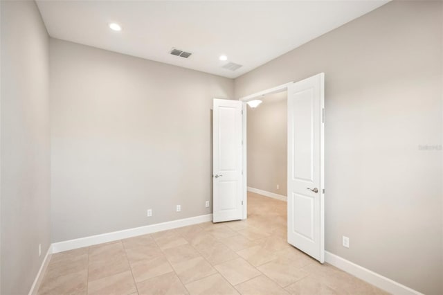 unfurnished bedroom with light tile patterned floors