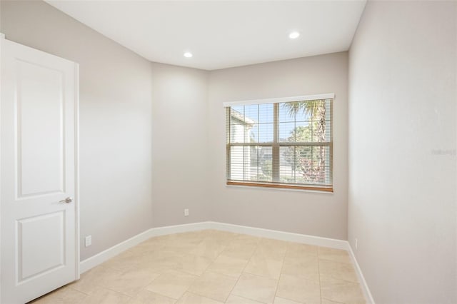 unfurnished room featuring light tile patterned flooring