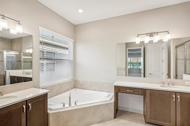 bathroom featuring vanity, tile patterned floors, shower with separate bathtub, and a healthy amount of sunlight