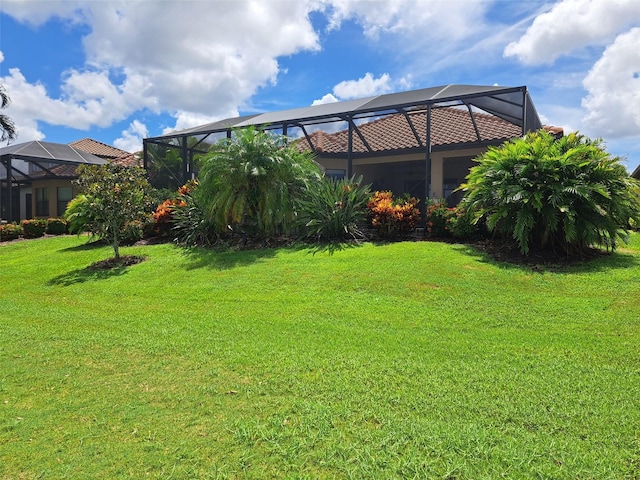 view of yard featuring glass enclosure