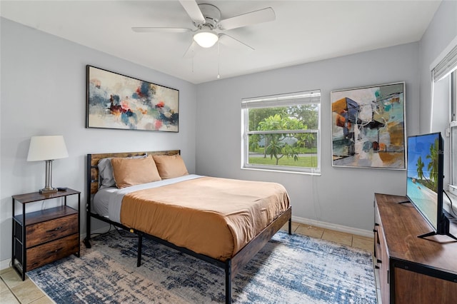 bedroom with light tile patterned flooring and ceiling fan