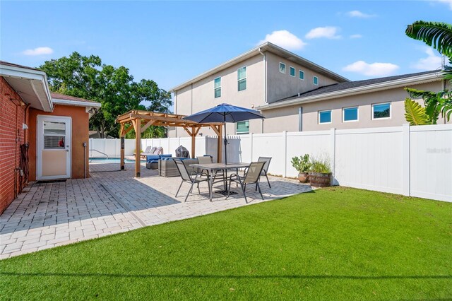 view of yard with a pergola and a patio