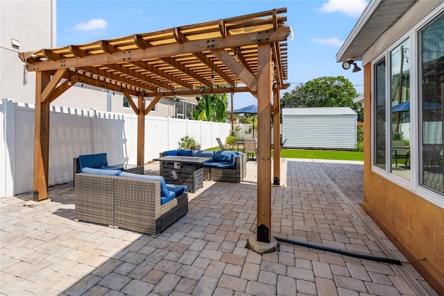 view of patio featuring an outdoor living space with a fire pit, a shed, and a pergola