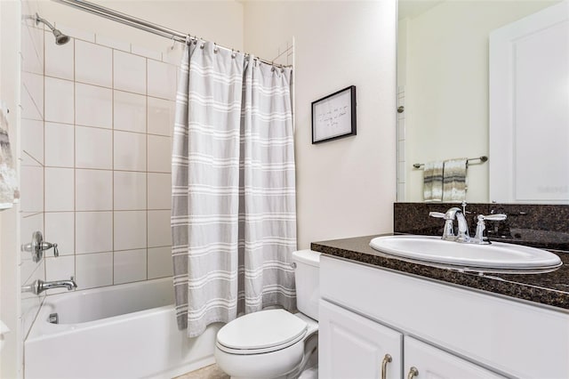 full bathroom featuring vanity, toilet, and shower / bath combination with curtain