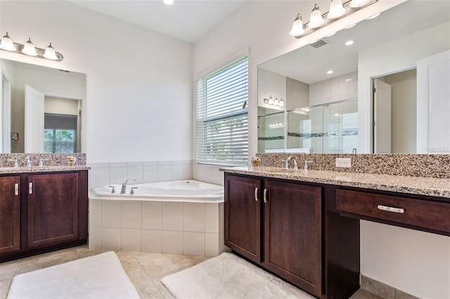 bathroom with vanity, plenty of natural light, separate shower and tub, and tile patterned floors