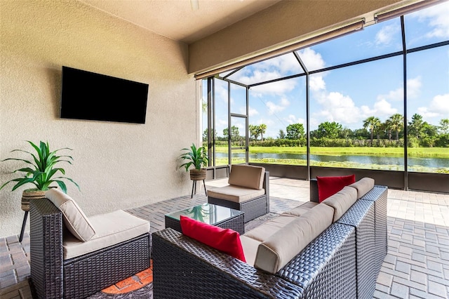 view of patio featuring an outdoor hangout area, a lanai, and a water view