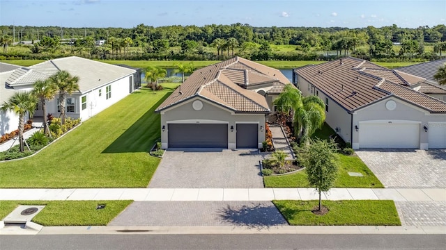 view of front of house with a front lawn and a garage