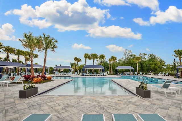 view of swimming pool featuring a patio and a gazebo