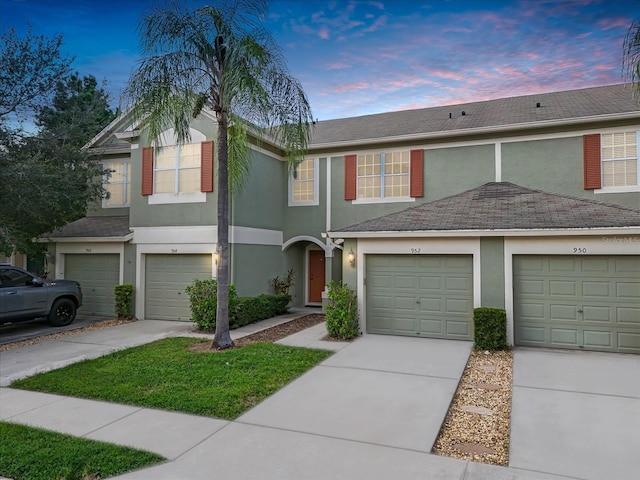 multi unit property featuring a garage