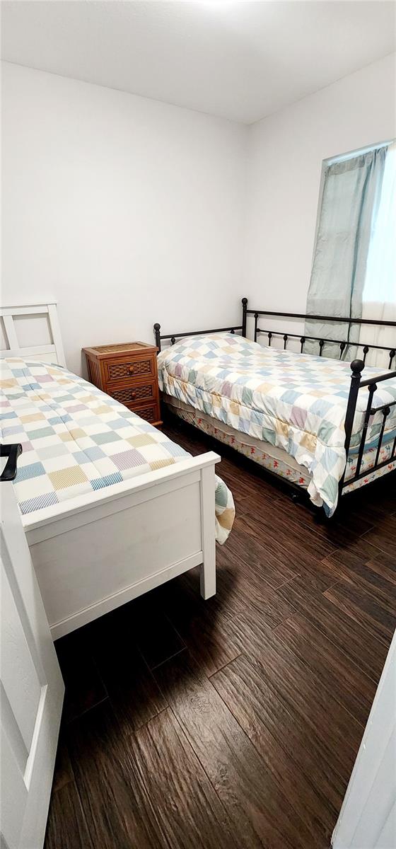 bedroom featuring dark hardwood / wood-style floors