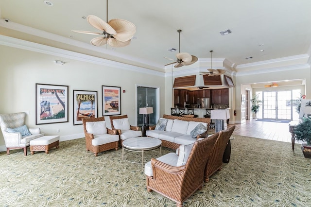 living room featuring ceiling fan and crown molding