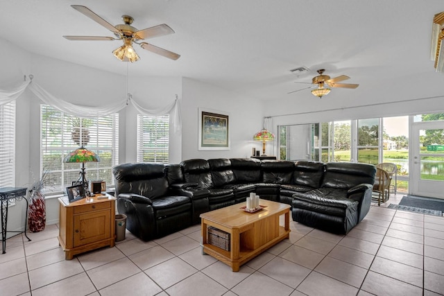 tiled living room with ceiling fan