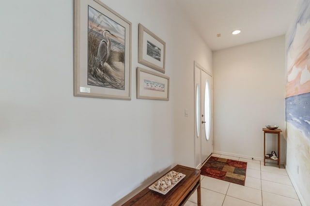 doorway to outside featuring light tile patterned floors