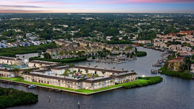 aerial view at dusk with a water view