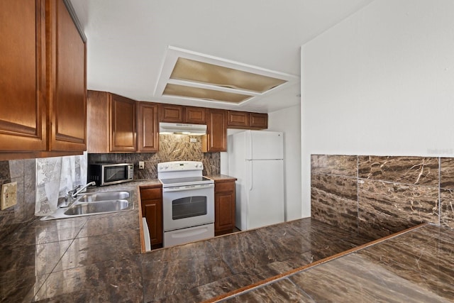 kitchen with sink, tasteful backsplash, ventilation hood, and white appliances