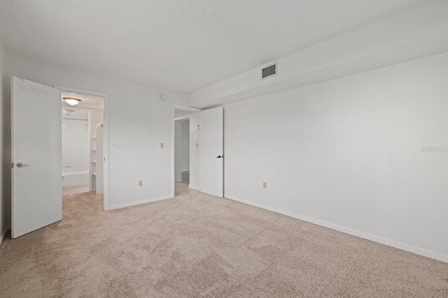 unfurnished bedroom with light carpet