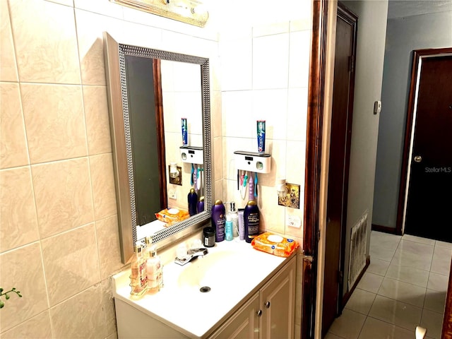 bathroom featuring tile patterned floors, tile walls, and vanity