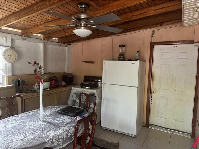 kitchen with white refrigerator, light tile patterned floors, ceiling fan, and wood ceiling