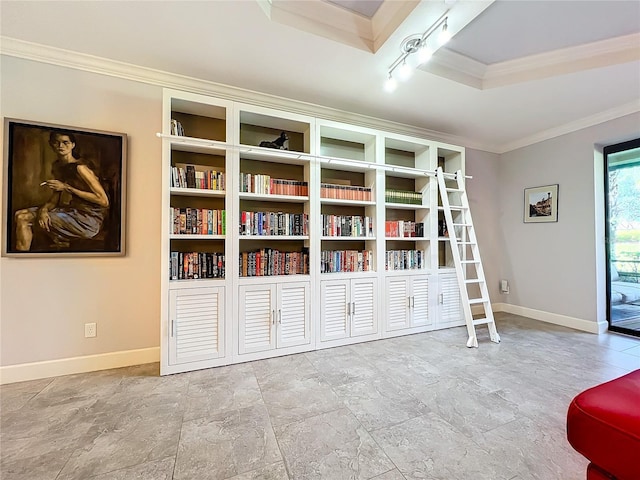 sitting room with baseboards, track lighting, and crown molding