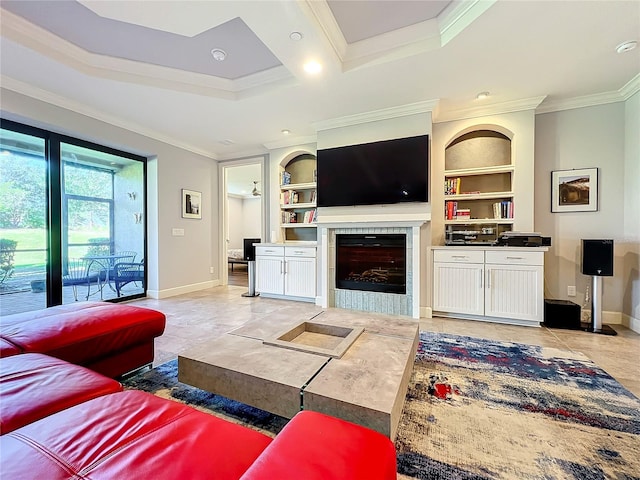 living room featuring light tile patterned flooring, ornamental molding, built in shelves, and a tile fireplace