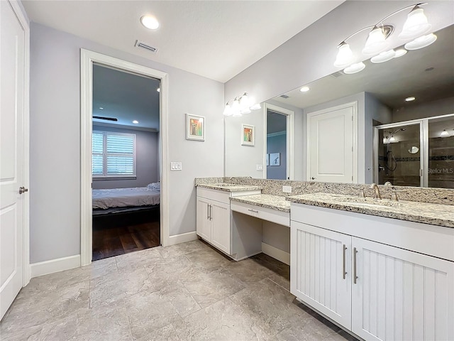 ensuite bathroom with ensuite bathroom, vanity, visible vents, baseboards, and a stall shower