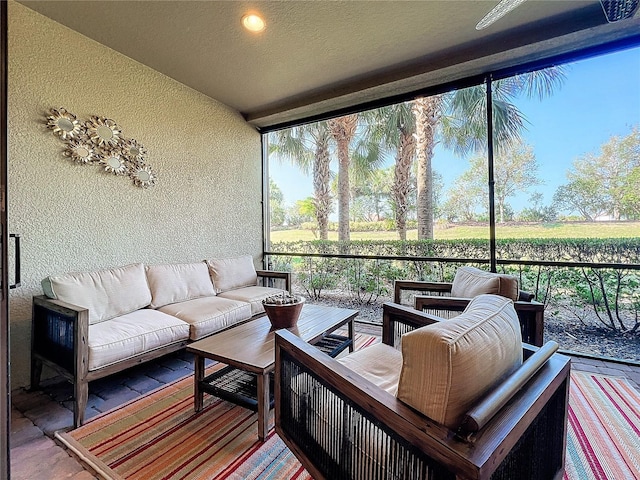 sunroom featuring a rural view