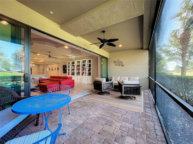 sunroom / solarium with ceiling fan