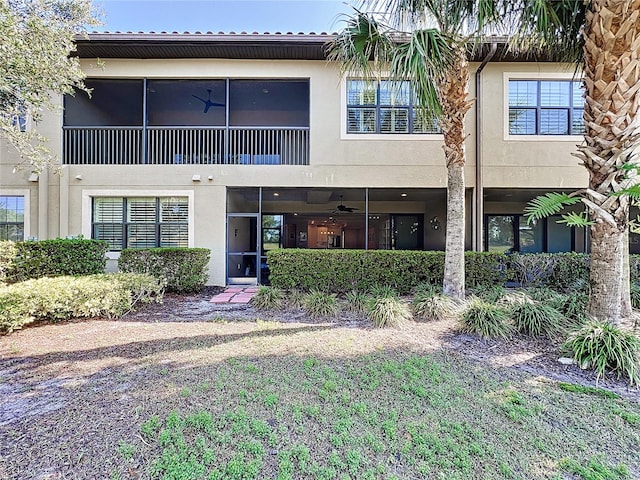 view of front of house featuring ceiling fan